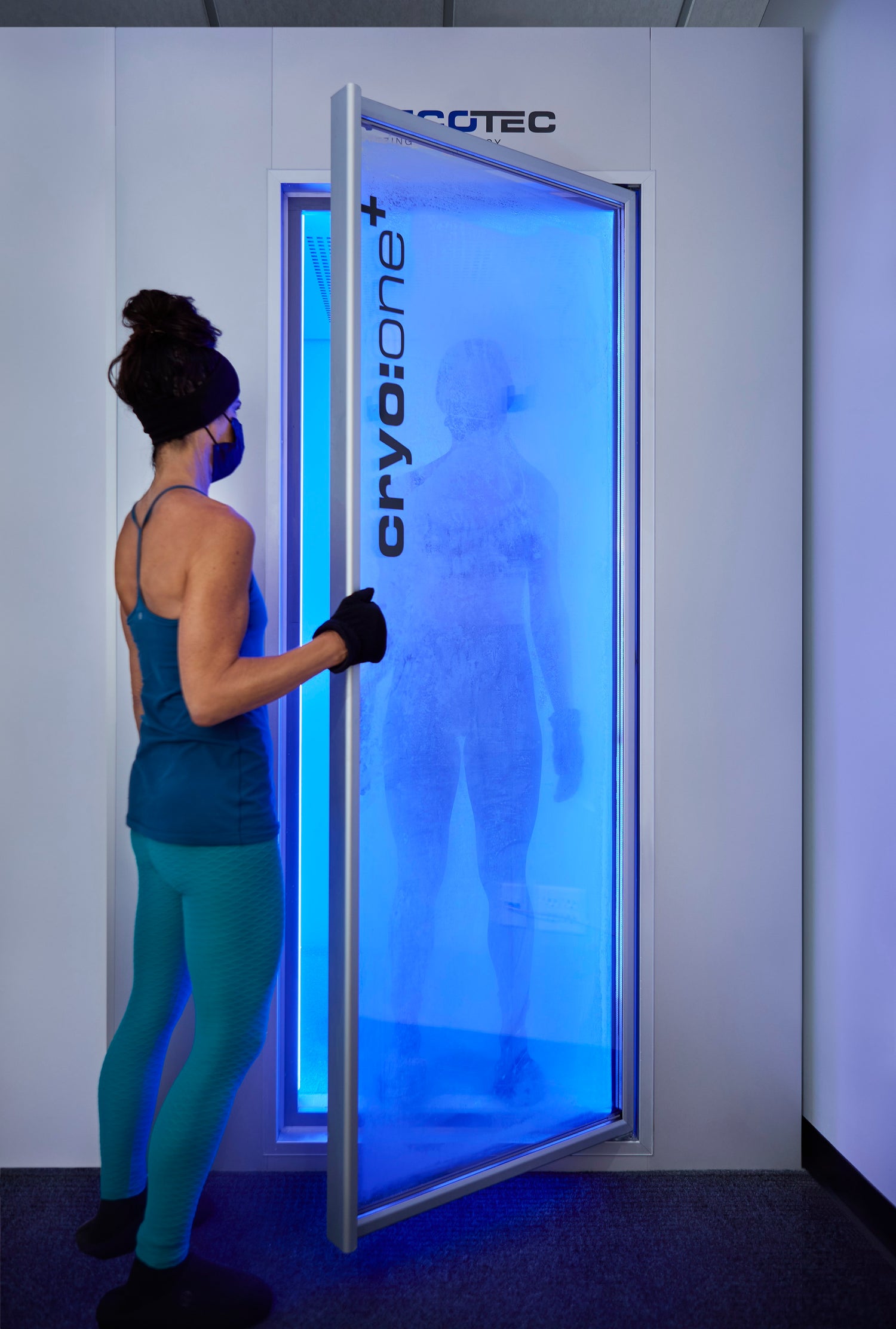 A woman entering a cryo chamber